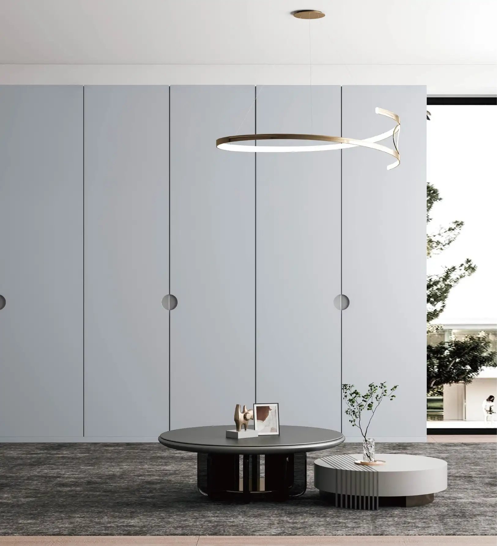 Pale blue wardrobe wall with round pulls and a ring pendant above a low table